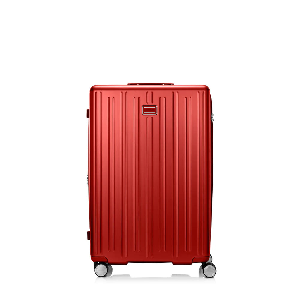 Front view of the American Tourister Reggio hard luggage in Red, highlighting its modern textured shell and smooth double spinner wheels. Available Now Online