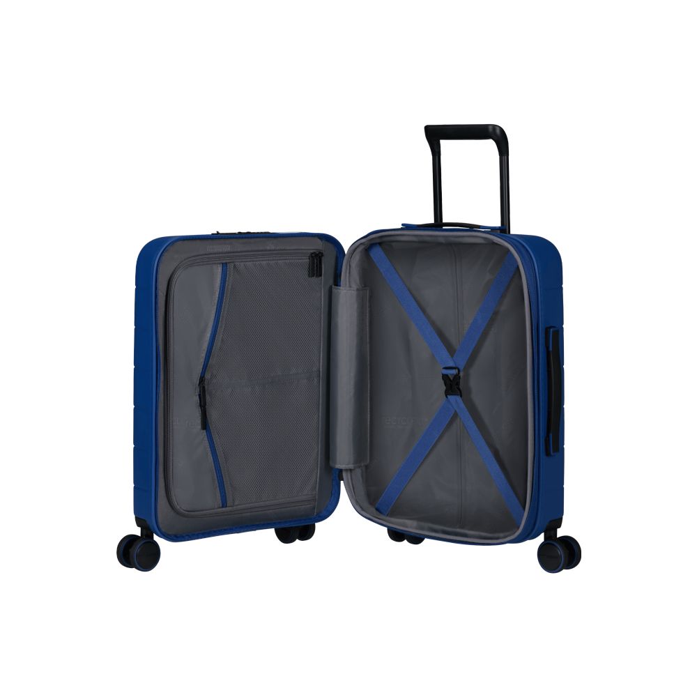 Inside view of the opened American Tourister Novastream hard suitcase Luggage in Navy Blue, with ribbed design, TSA lock, and spinner wheels. Order Online Today