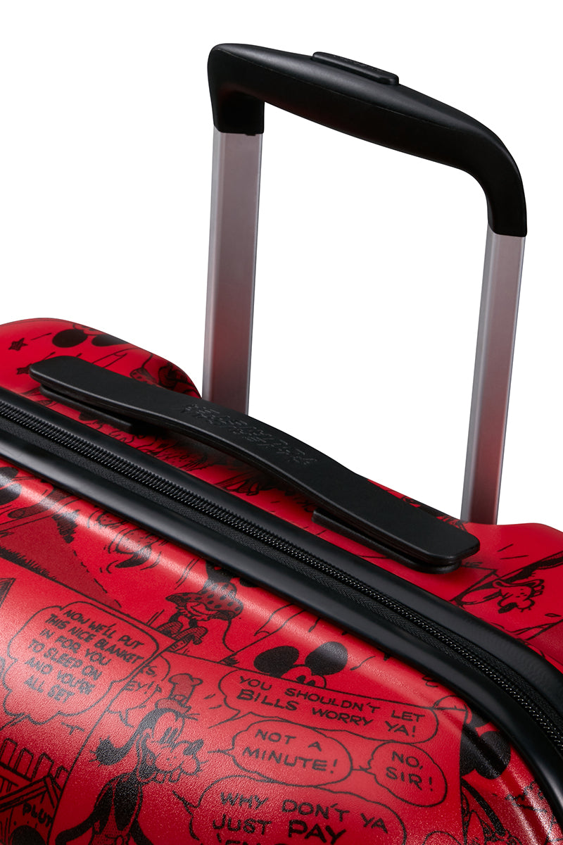 A view of the extended red telescopic trolley handle of the American Tourister Disney Wavebreaker Mickey Comics Red spinner , showcasing the ergonomic grip and color-coordinated aluminum tubes.. Available Online