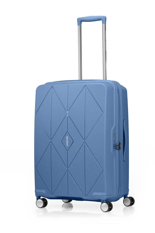 Angled view of the American Tourister Argyle hard suitcase in Blue Slate, with geometric design, TSA lock, and spinner wheels Available Online
