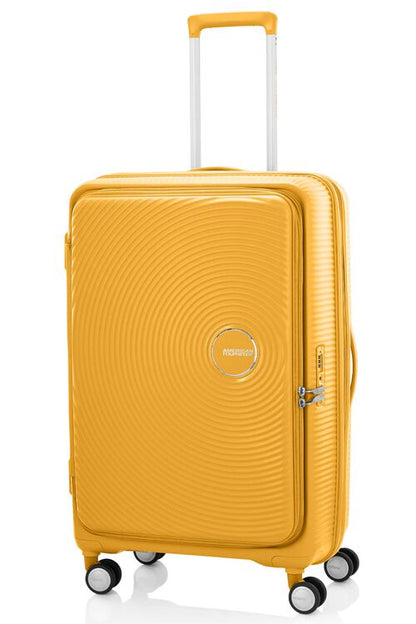 Angled view of the American Tourister Curio Book Opening hard luggage spinner in Yellow, showcasing its iconic concentric circle "ripple" design on a durable polypropylene shell. Find Now Online