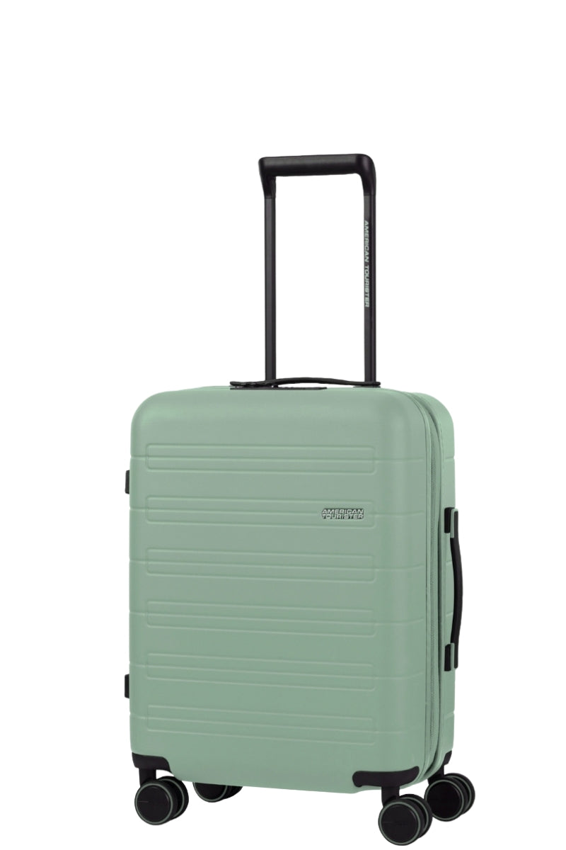 Angled view of the American Tourister Novastream Cabin hard suitcase Luggage in Nomad Green, with ribbed design, TSA lock, and spinner wheels. Order Online Today