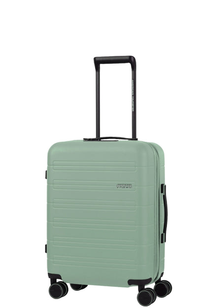 Angled view of the American Tourister Novastream Cabin hard suitcase Luggage in Nomad Green, with ribbed design, TSA lock, and spinner wheels. Order Online Today
