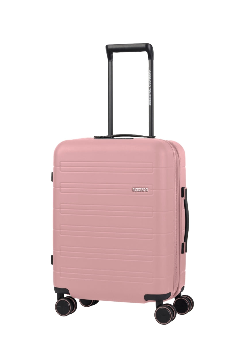 Angled view of the American Tourister Novastream Cabin hard suitcase Luggage in Vintage Pink, with ribbed design, TSA lock, and spinner wheels. Order Online Today