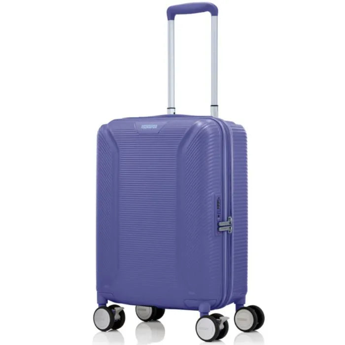 Angled view of the American Tourister Robotech spinner cabin hard luggage in Future Dusk, showing the sleek textured hardshell and robust double wheels. Shop Online