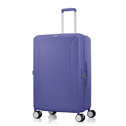 Angled view of the American Tourister Robotech spinner hard luggage in Future Dusk, showing the sleek textured hardshell and robust double wheels. Shop Online