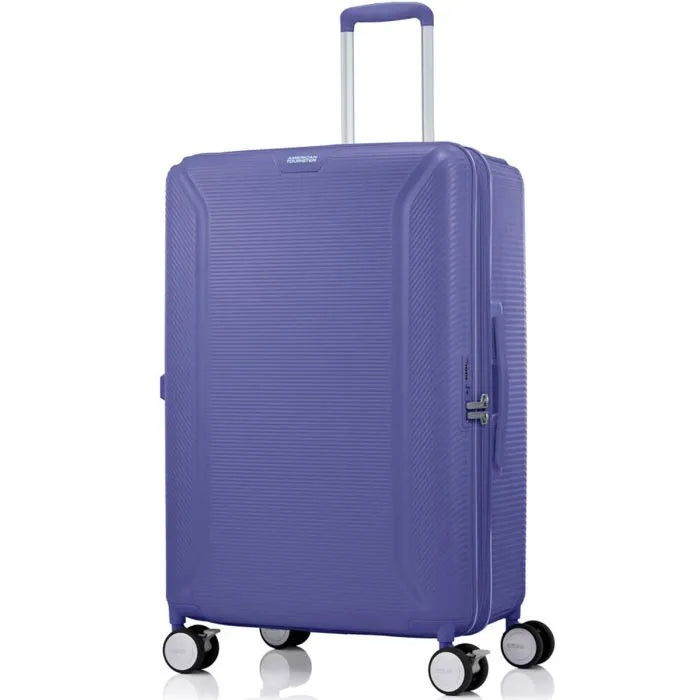 Angled view of the American Tourister Robotech spinner large hard luggage in Future Dusk, showing the sleek textured hardshell and robust double wheels. Shop Online