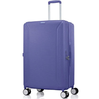 Angled view of the American Tourister Robotech spinner large hard luggage in Future Dusk, showing the sleek textured hardshell and robust double wheels. Shop Online