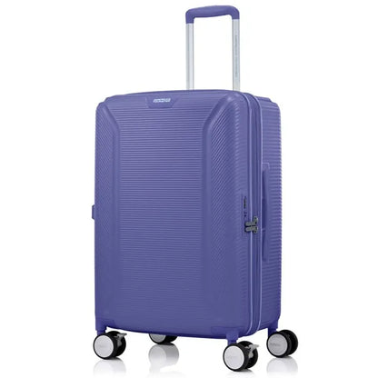 Angled view of the American Tourister Robotech spinner medium hard luggage in Future Dusk, showing the sleek textured hardshell and robust double wheels. Shop Online