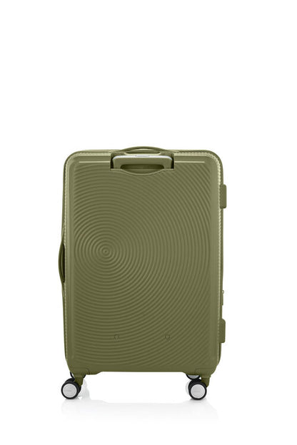 Back view of the American Tourister Curio Book Opening hard luggage spinner in Bo Khaki, showcasing its iconic concentric circle "ripple" design on a durable polypropylene shell. Find Now Online