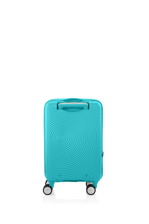 Back view of the American Tourister Curio Book Opening hard luggage spinner in Turquoise, showcasing its iconic concentric circle "ripple" design on a durable polypropylene shell. Find Now Online