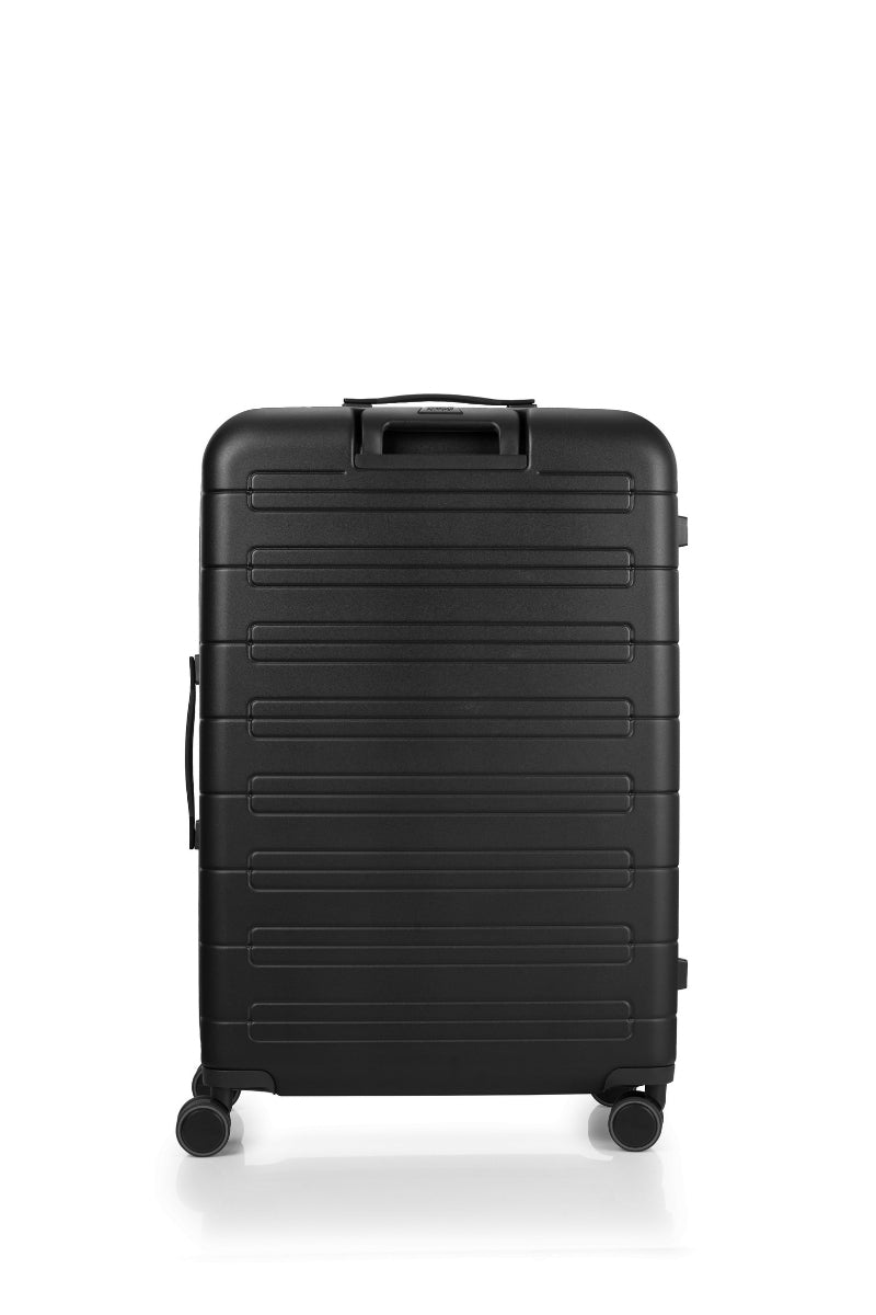 Back view of the American Tourister Novastream Medium hard suitcase Luggage in Dark Slate, with ribbed design, TSA lock, and spinner wheels. Order Online Today