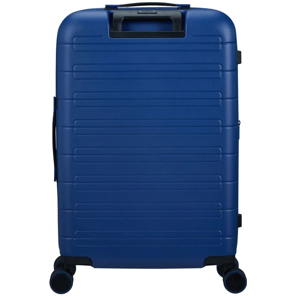 Back view of the American Tourister Novastream hard suitcase Luggage in Navy Blue, with ribbed design, TSA lock, and spinner wheels. Order Online Today