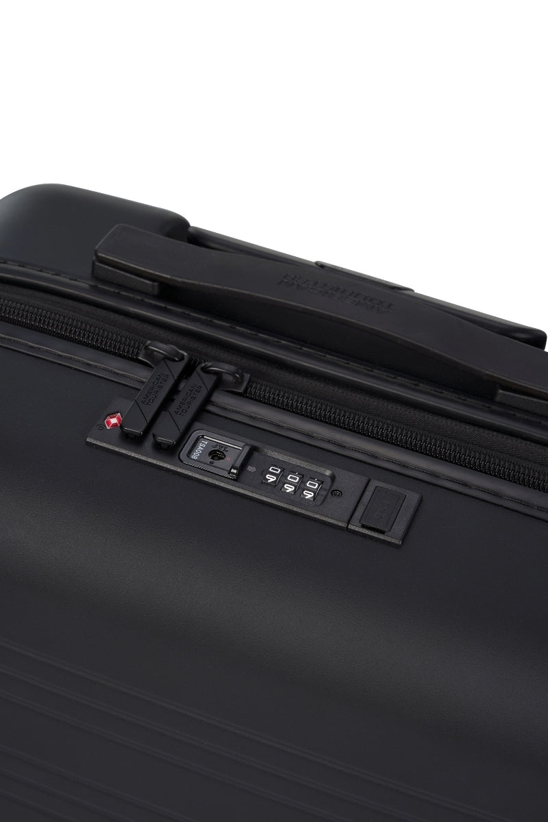 Close-up Top view of the American Tourister Novastream hard suitcase Luggage in Dark Slate, with ribbed design, TSA lock, and spinner wheels. Order Online Today