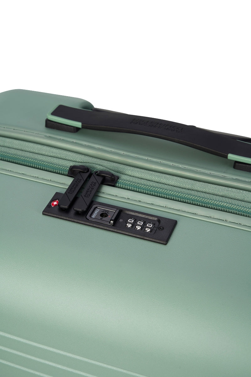 Close-up top view of the American Tourister Novastream hard suitcase Luggage in Nomad Green, with ribbed design, TSA lock, and spinner wheels. Order Online Today