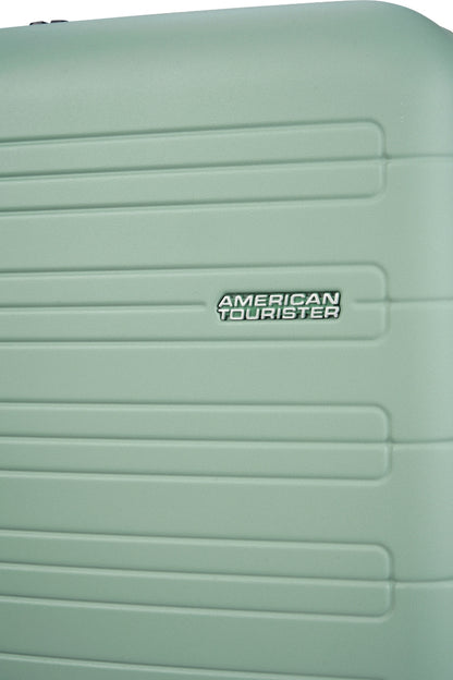Close-up view of the American Tourister Novastream hard suitcase Luggage in Nomad Green, with ribbed design, TSA lock, and spinner wheels. Order Online Today