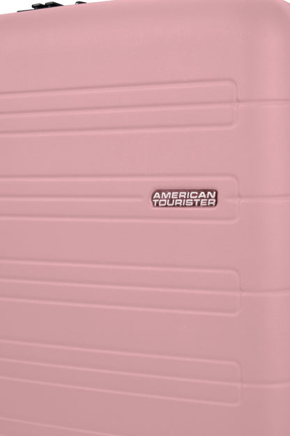 Close-up view of the American Tourister Novastream hard suitcase Luggage in Vintage Pink, with ribbed design, TSA lock, and spinner wheels. Order Online Today