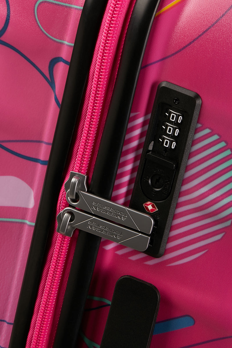 Close-up view of the integrated TSA-approved combination lock of the Disney Wavebreaker Spinner, keeping the Disney-themed zippers securely in place. Find Now Online