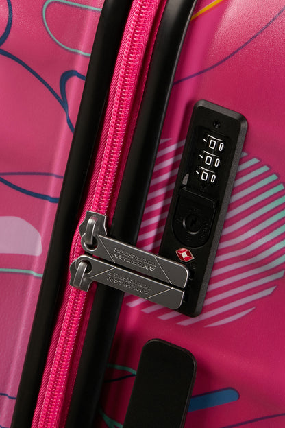 Close-up view of the integrated TSA-approved combination lock of the Disney Wavebreaker Spinner, keeping the Disney-themed zippers securely in place. Find Now Online