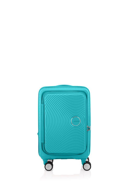 Front view of the American Tourister Curio Book Opening hard luggage spinner in Turquoise, showcasing its iconic concentric circle "ripple" design on a durable polypropylene shell. Find Now Online