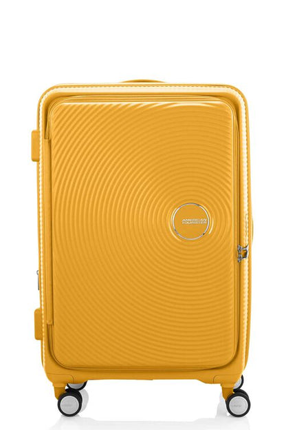 Front view of the American Tourister Curio Book Opening hard luggage spinner in Yellow, showcasing its iconic concentric circle "ripple" design on a durable polypropylene shell. Find Now Online