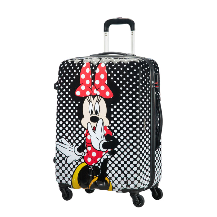 Front view of the American Tourister Disney Legends medium spinner luggage, featuring a classic, high-gloss polka dot Minnie Mouse design with a bright red bow. Shop Now Online