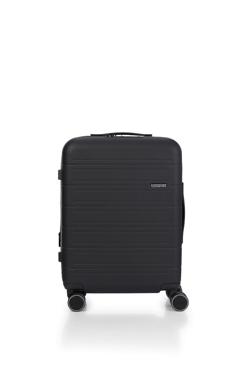 Front view of the American Tourister Novastream Cabin hard suitcase Luggage in Dark Slate, with ribbed design, TSA lock, and spinner wheels. Order Online Today