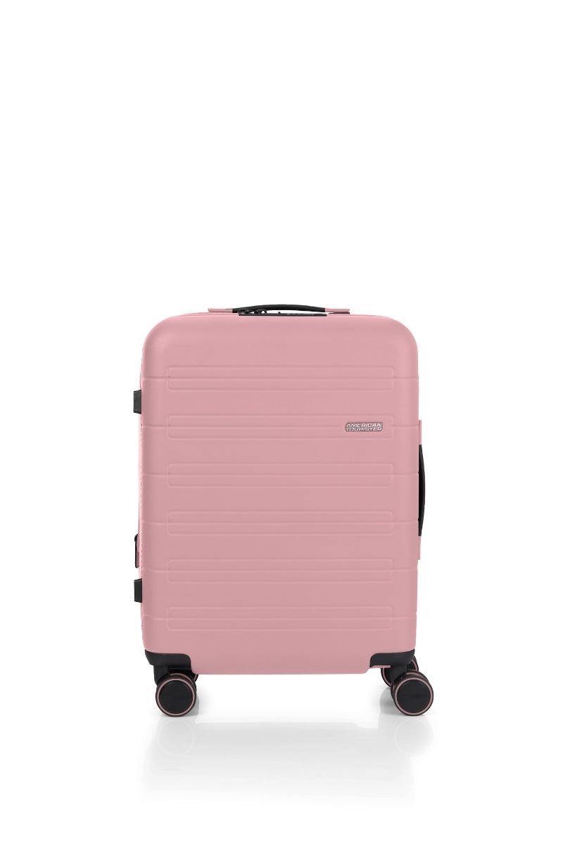 Front view of the American Tourister Novastream Cabin hard suitcase Luggage in Vintage Pink, with ribbed design, TSA lock, and spinner wheels. Order Online Today