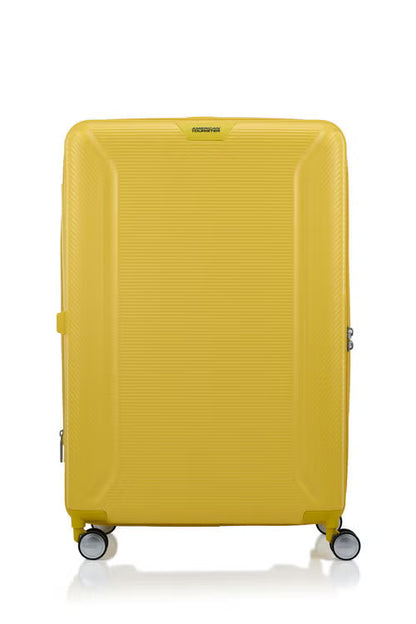 Front view of the American Tourister Robotech spinner hard luggage in Citron Yellow, showing the sleek textured hardshell and robust double wheels. Shop Online