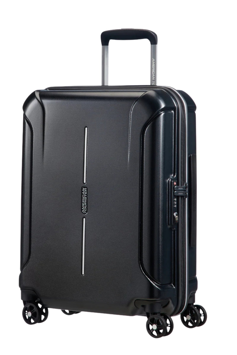 Front view of the American Tourister Technum Spinner large in Diamond Black, highlighting its modern industrial texture and bold, boxy hardshell design. Shop the Latest Online