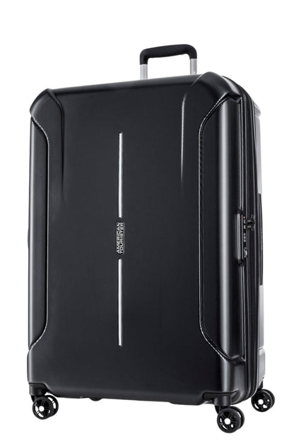 Front view of the American Tourister Technum Spinner xl in Diamond Black, highlighting its modern industrial texture and bold, boxy hardshell design. Shop the Latest Online