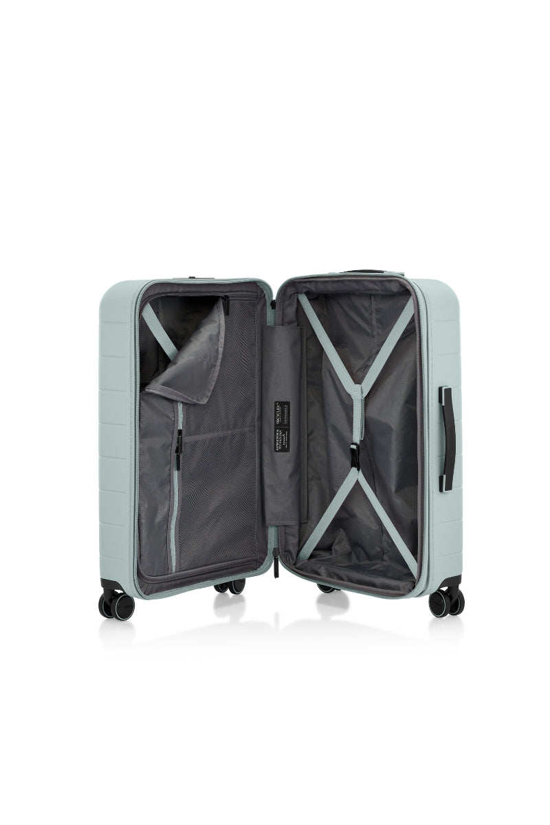 Inside view of the opened American Tourister Novastream hard suitcase Luggage in Nomad Green, with ribbed design, TSA lock, and spinner wheels. Order Online Today