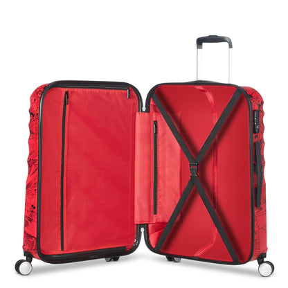 Open interior of the American Tourister Disney Wavebreaker Mickey Comics Red spinner, revealing the character-themed grey lining, red elastic cross-straps, and a zippered mesh divider. Available Online