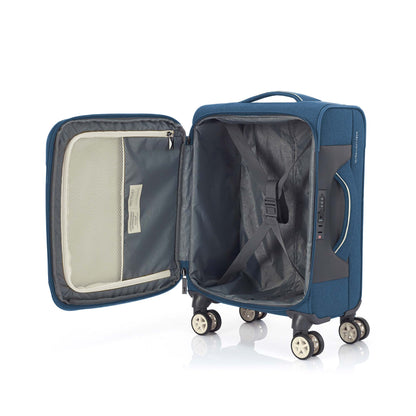 Open interior view of the American Tourister Droyce soft-shell spinner in Navy, showcasing the grey rPET antimicrobial lining, cross-straps, and the multi-pocket organization system.