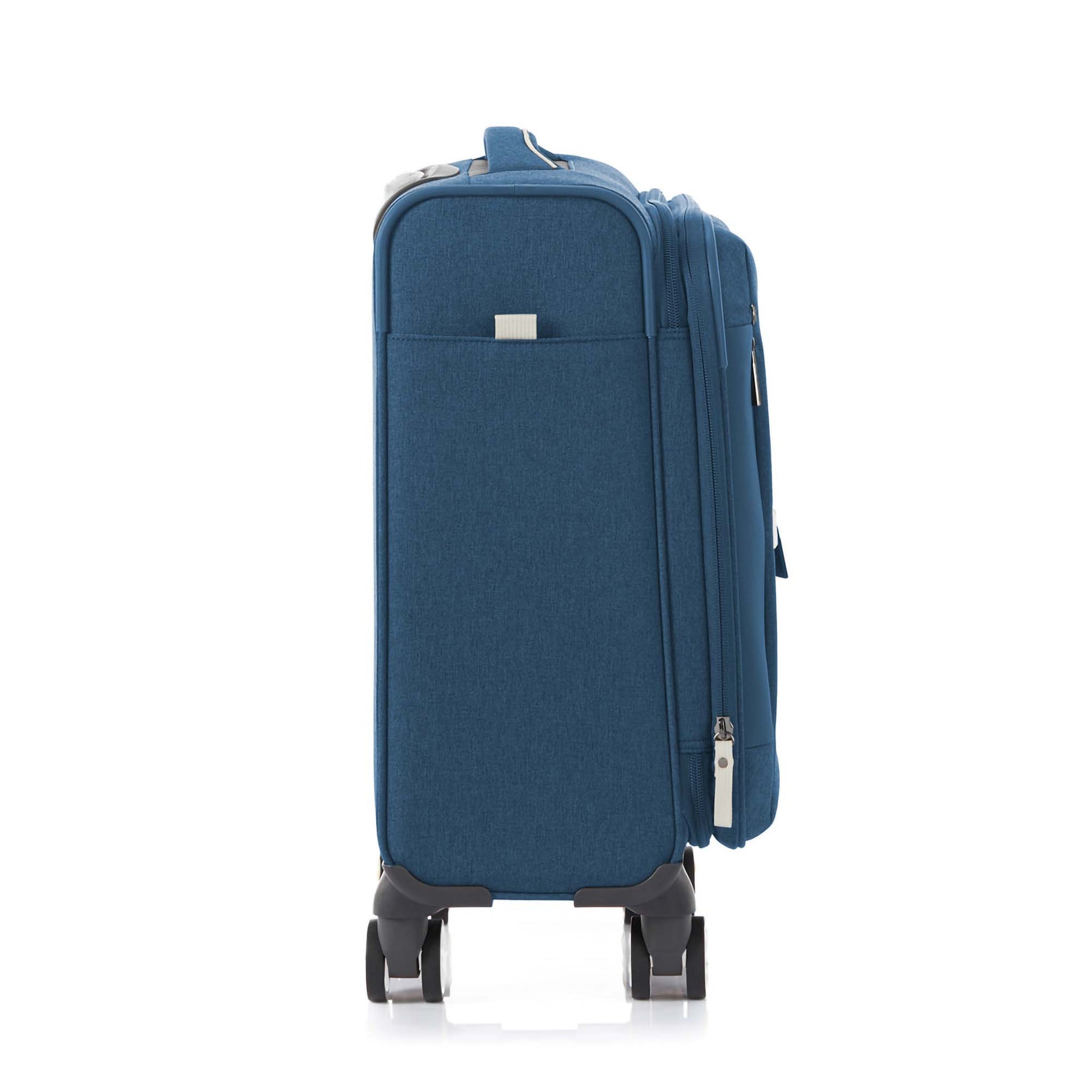 Other side view of the American Tourister Droyce soft-shell spinner in Navy, featuring a modern dip-dye color gradient, grey accents, and a distinctive metal logo. Shop Now Online