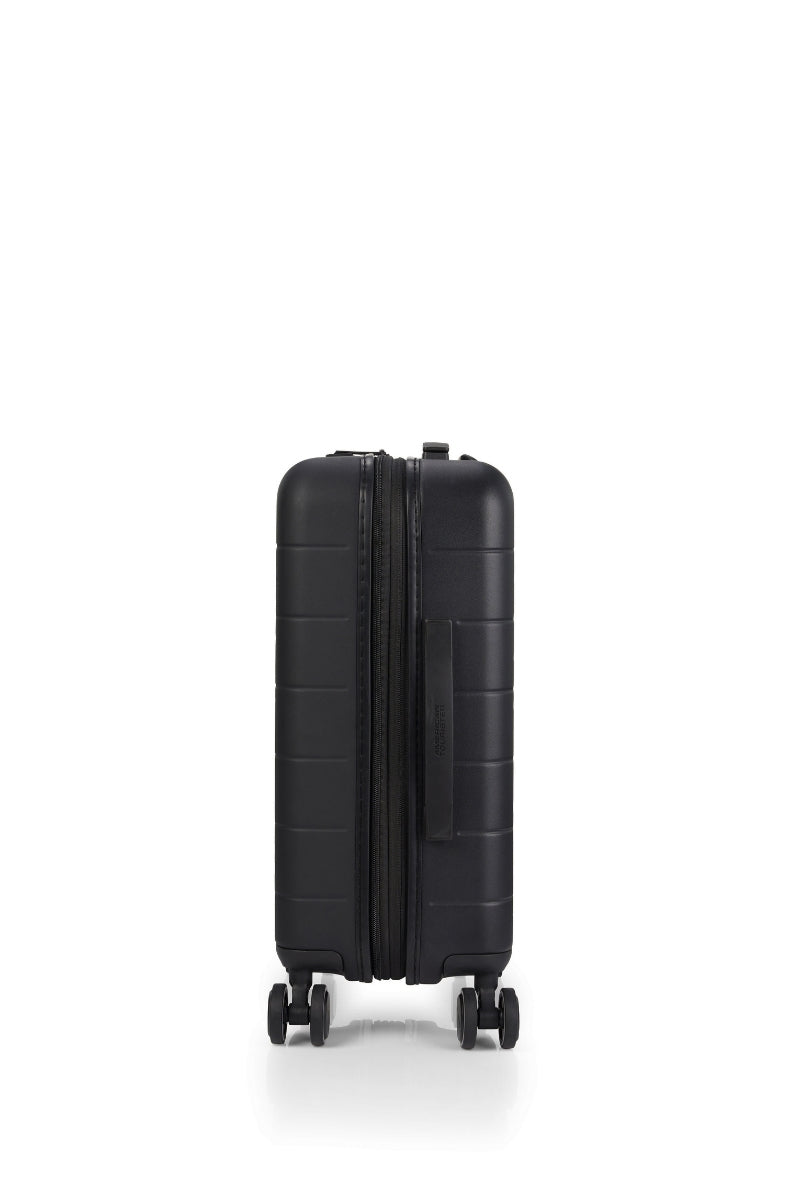Other side view of the American Tourister Novastream Cabin hard suitcase Luggage in Dark Slate, with ribbed design, TSA lock, and spinner wheels. Order Online Today