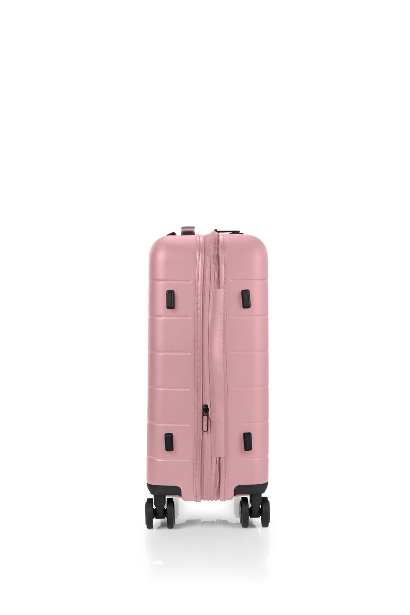 Other side view of the American Tourister Novastream hard suitcase Luggage in Vintage Pink, with ribbed design, TSA lock, and spinner wheels. Order Online Today