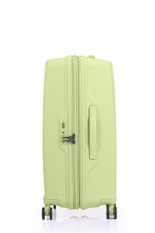 Side view of the American Tourister Argyle  hard suitcase in Frozen Matcha with geometric design, TSA lock, and spinner wheels Available Online