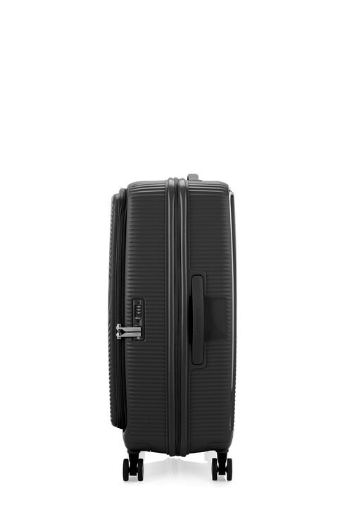 Side view of the American Tourister Curio Book Opening hard luggage spinner in Black, showcasing the zippers and the durable polypropylene shell. Find Now Online
