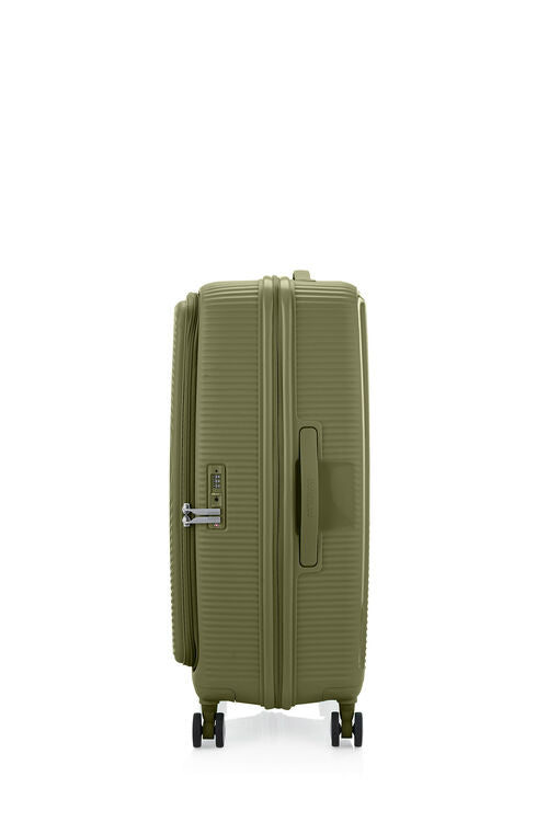 Side view of the American Tourister Curio Book Opening hard luggage spinner in Bo Khaki, showcasing the zippers and the durable polypropylene shell. Find Now Online