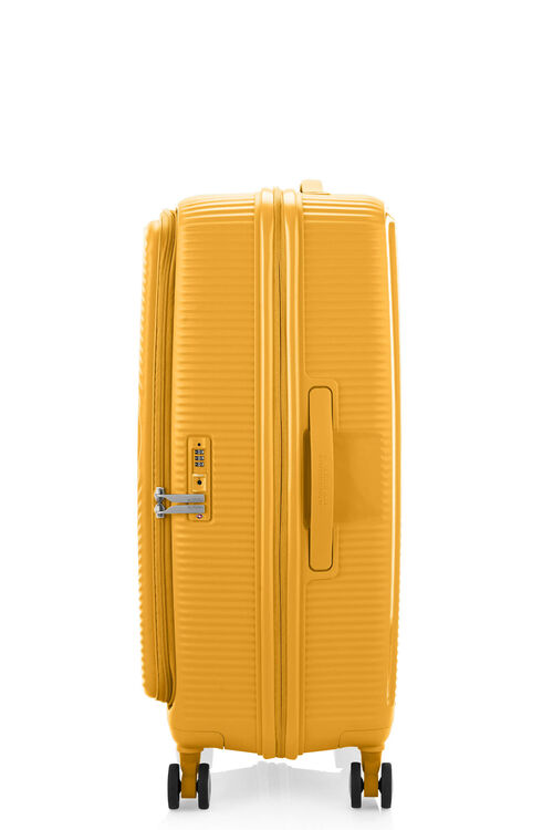 Side view of the American Tourister Curio Book Opening hard luggage spinner in Yellow, showcasing the zippers and the durable polypropylene shell. Find Now Online
