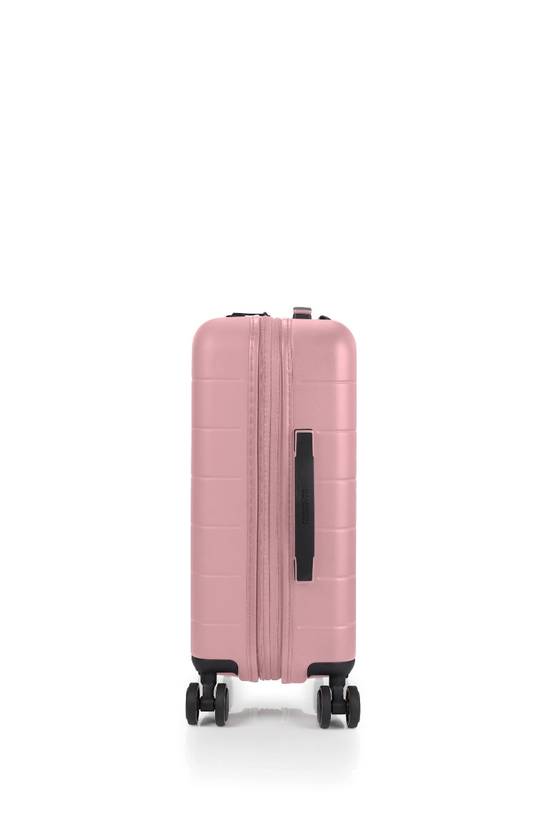 Side view of the American Tourister Novastream hard suitcase Luggage in Vintage Pink, with ribbed design, TSA lock, and spinner wheels. Order Online Today