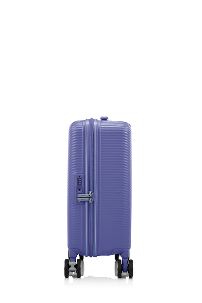 Side view of the American Tourister Robotech spinner hard luggage in Future Dusk, showing the sleek textured hardshell and robust double wheels. Shop Online