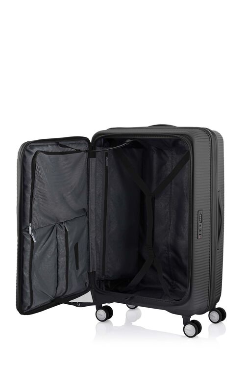 The interior of the Curio Book Opening suitcase in Black, demonstrating the 80/20 PlentiVol™ split with a deep main compartment, zippered mesh dividers. Find Now Online