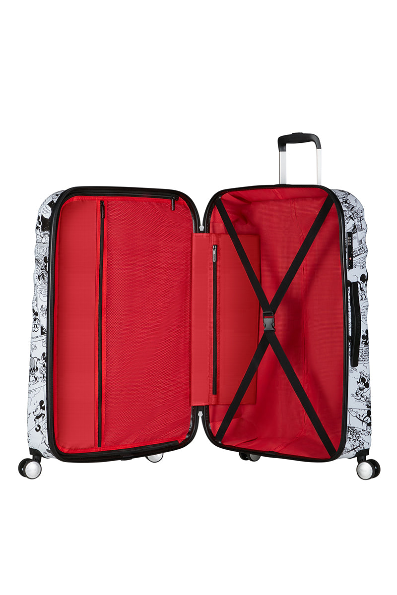 The open interior of the Disney Wavebreaker luggage, showing the character-themed fabric lining, cross-straps, and zippered compartment. Available Online