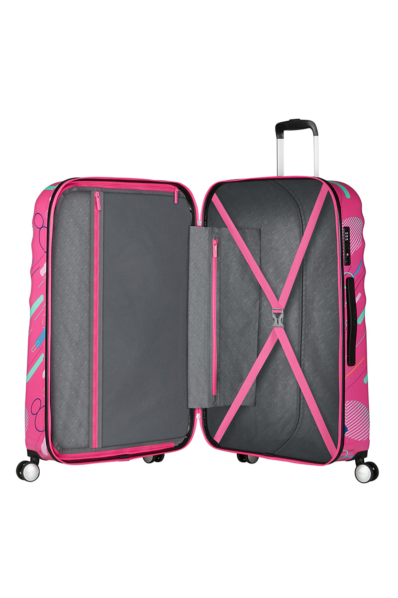 The open interior view of the Disney Wavebreaker luggage, highlighting the character-themed fabric lining, cross-straps, and zippered compartment. Find Now Online