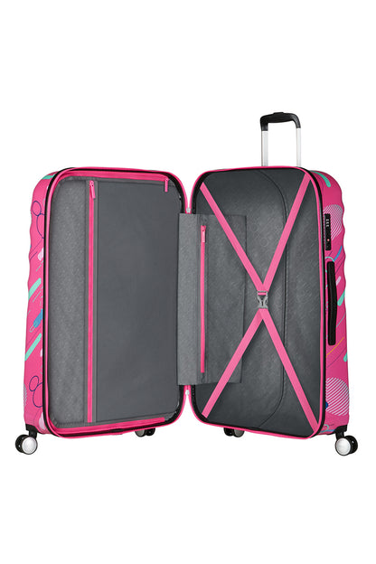 The open interior view of the Disney Wavebreaker luggage, highlighting the character-themed fabric lining, cross-straps, and zippered compartment. Find Now Online