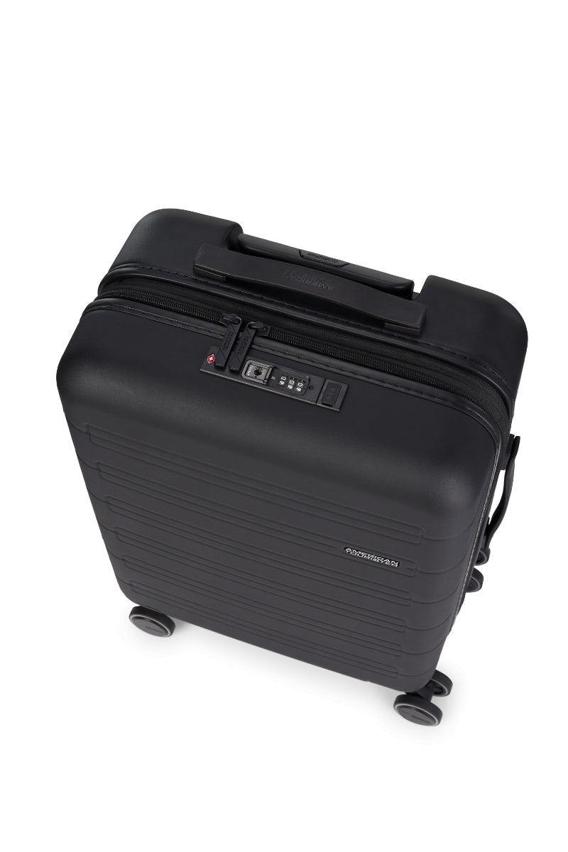 Top view of the American Tourister Novastream hard suitcase Luggage in Dark Slate, with ribbed design, TSA lock, and spinner wheels. Order Online Today