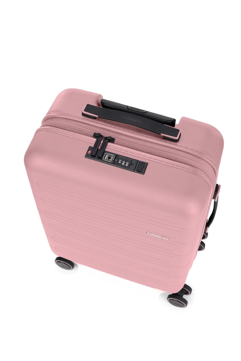 Top view of the American Tourister Novastream hard suitcase Luggage in Vintage Pink, with ribbed design, TSA lock, and spinner wheels. Order Online Today
